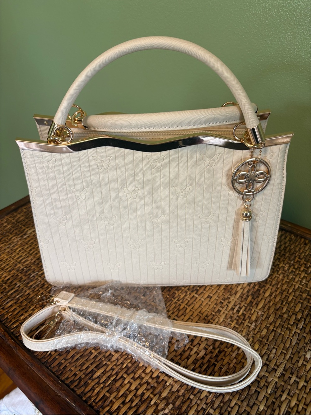 Chic Cream Structured Satchel with Gold Tassel Charm